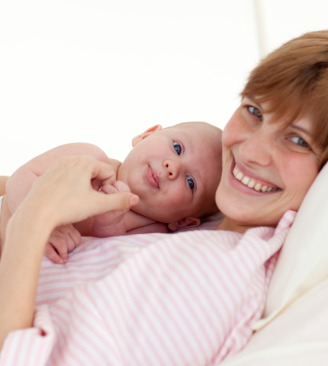 Mother embracing her newborn baby